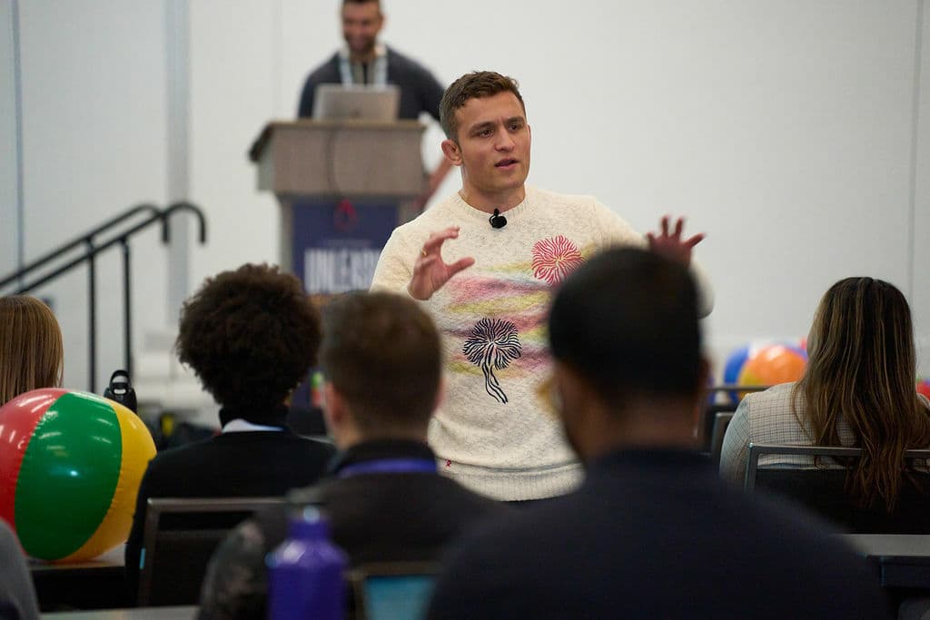 man presenting to a crowd