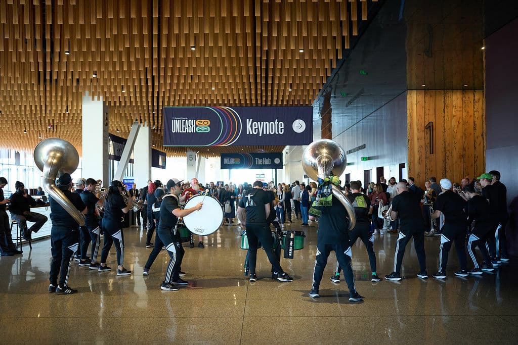 Marching band at a industry conference indoors, in the lobby