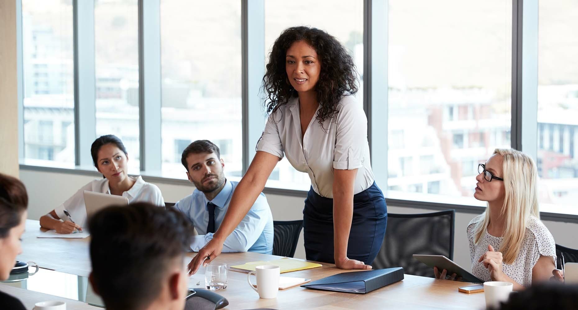 Woman standing during a meeting in a conference room