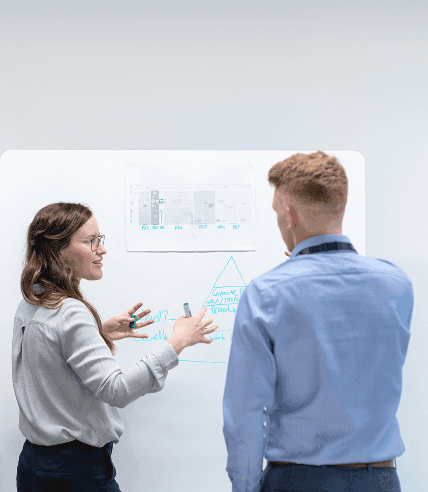 employees working together on a white board